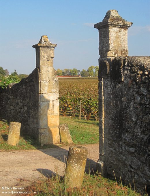 Stone gateposts and vines beyond, October 2011 Château Doisy-Védrines